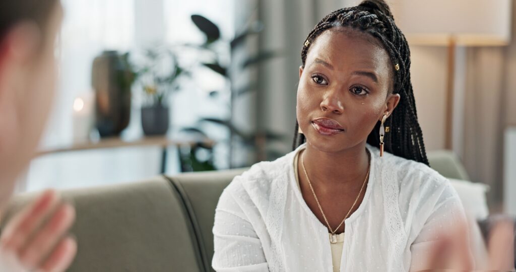 A woman talks to her therapist during therapy in virginia
